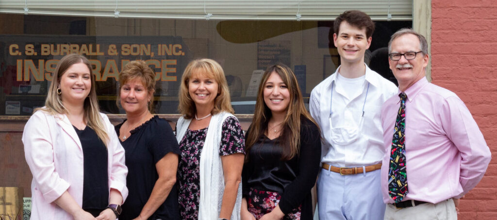 C.S. Burrall and Son Insurance Team Outside Storefront